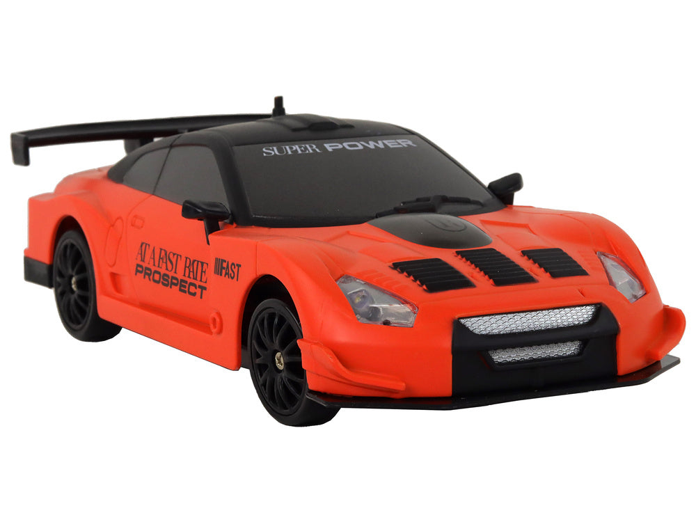 Auto na daljinsko upravljanje R/C 1:24  s izmjenjivim kotačima - narančasti